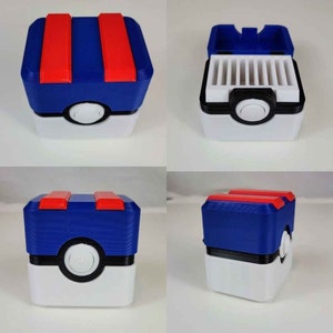 May include: A blue and red Pokemon card storage box with a white base and a Pokeball design. The box is open to reveal a compartment with slots for holding cards.