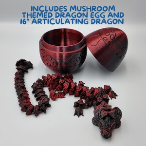 May include: A red mushroom-themed dragon egg with a 16-inch articulated dragon. The egg is open and the dragon is made of small, red, mushroom-shaped pieces.