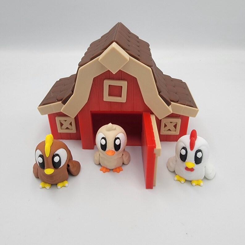 May include: A red barn with a brown roof and three cartoon chicks. The chicks are brown, beige, and white with yellow and orange details. The barn has a red door and beige trim.