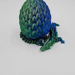dual color blue/green mystery dragon egg with 13.5 inch gemstone dragon inside. twist enclosure egg