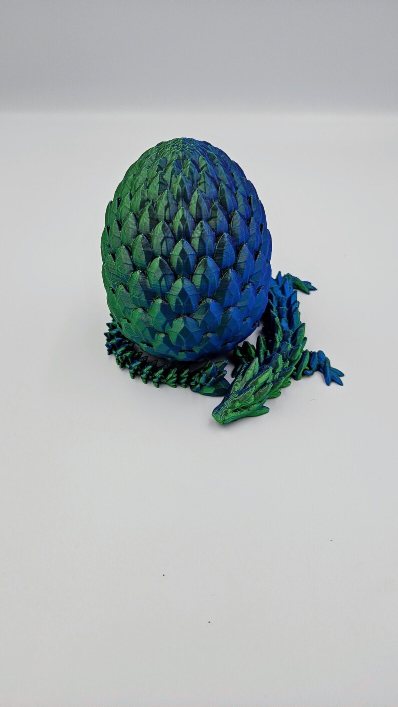 dual color blue/green mystery dragon egg with 13.5 inch gemstone dragon inside. twist enclosure egg