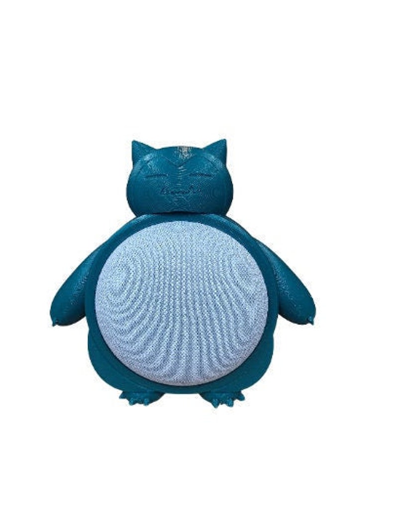 May include: A teal blue 3D printed speaker shaped like a cartoon character. The speaker has a light blue front with a textured pattern.