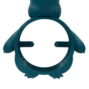 May include: A teal blue 3D printed Pokemon character, Snorlax, with a round opening in the center. The character is designed to hold a phone or other small device.