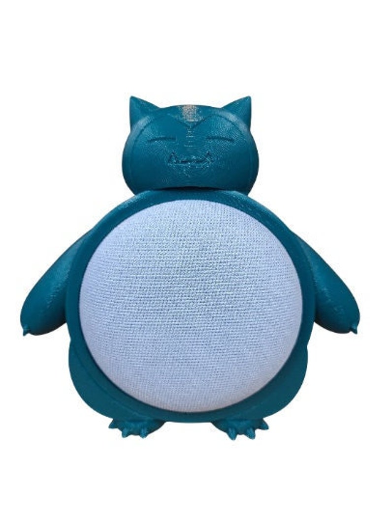 May include: A teal blue 3D printed Pokemon character, resembling a Snorlax, designed to hold a smart speaker. The character has a white, textured surface where the speaker would sit.