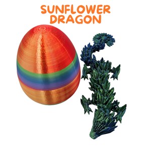 May include: A rainbow-colored egg-shaped object and a green and blue dragon figurine. The text "SUNFLOWER DRAGON" is written in orange above the objects.