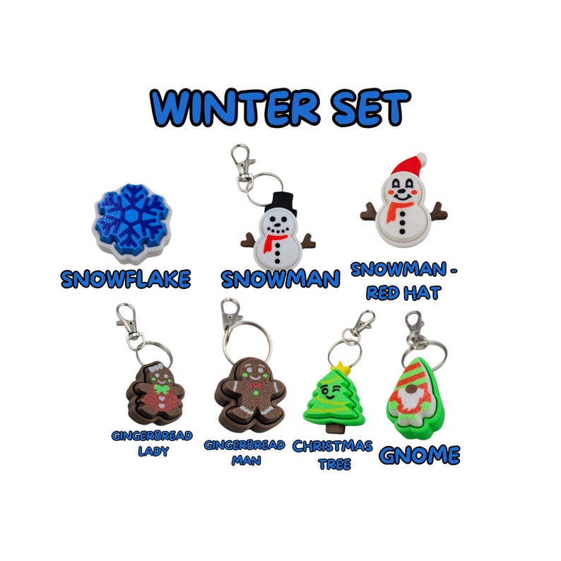 May include: A set of winter-themed keychains featuring a snowflake, snowman, gingerbread man, gingerbread lady, Christmas tree, and gnome. The keychains are made of colorful, detailed plastic.
