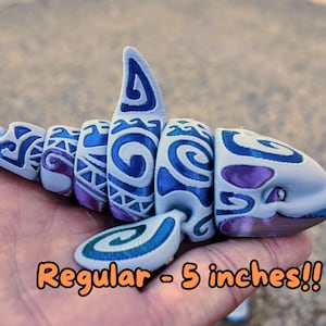 May include: A 5-inch blue and purple 3D printed shark with a tribal pattern.  "Regular - 5 inches!!" is written below the shark.