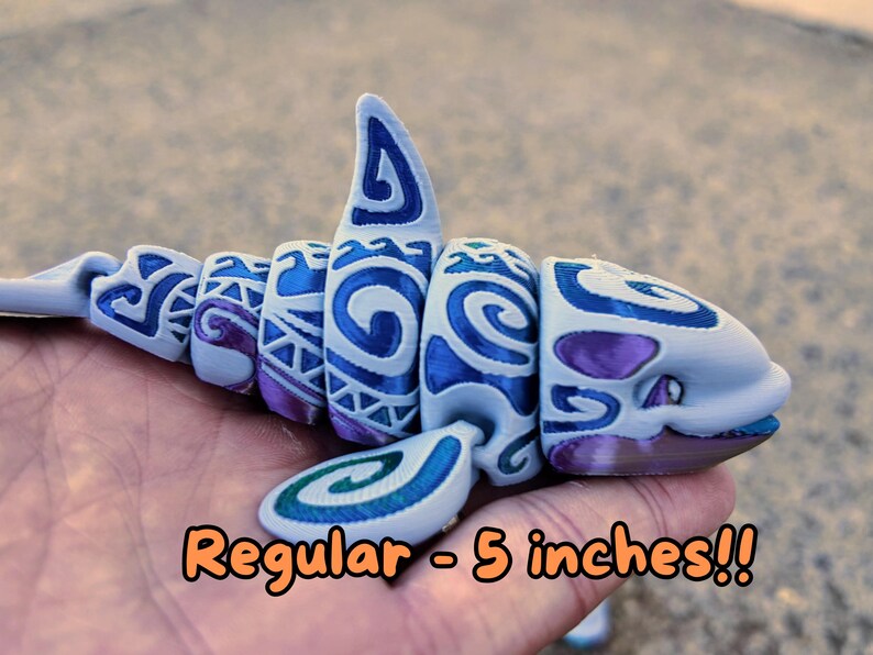 May include: A 5-inch blue and purple 3D printed shark with a tribal pattern.  "Regular - 5 inches!!" is written below the shark.