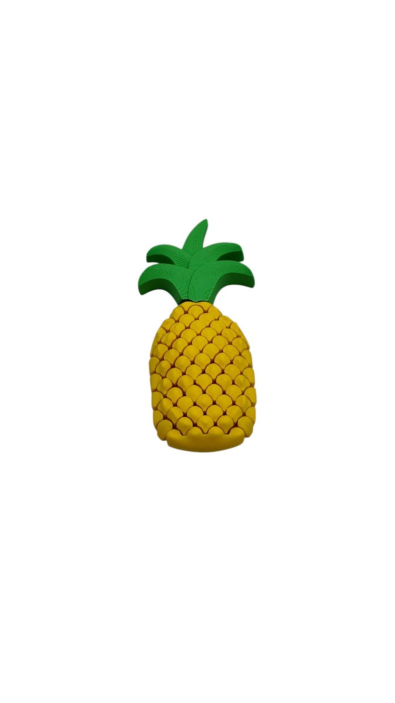 May include: A yellow pineapple with a green leafy top. The pineapple has a textured surface, and the leaves are a vibrant green. The fruit is a bright, cheerful design, perfect for tropical-themed decor.