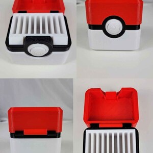 May include: A red and white 3D printed box with a Pokeball design on the front. The box has a hinged lid and a compartment inside for holding small items.
