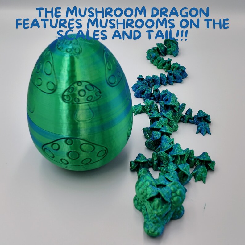 May include: A green and blue 3D printed dragon egg with mushroom designs. The dragon's tail is made of individual 3D printed scales, each with a mushroom design. The text "THE MUSHROOM DRAGON FEATURES MUSHROOMS ON THE SCALES AND TAIL!!!" is written in blue text on a white background.