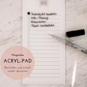 Könnte beinhalten: Ein weißer Trockenlöschblock mit einem schwarzen Stift und dem Text "TO DO" oben. Der Block hat eine Liste von Aufgaben, die in schwarzer Tinte geschrieben sind, darunter "Produktfotos bearbeiten", "Insta-Planung", "Friseurtermin" und "Papier nachbestellen". Der Block hat auch den Text "Magisches ACRYLPAD" und "Beschriften und einfach wieder abwischen".