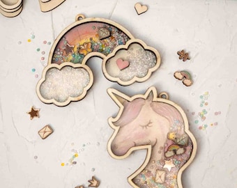 May include: Two wooden craft kits featuring a rainbow and a unicorn head. Both kits have a clear resin area to fill with beads and other embellishments. The rainbow kit includes a heart, a star, and a diamond. The unicorn kit includes a star, a rainbow, a crown, and a diamond.