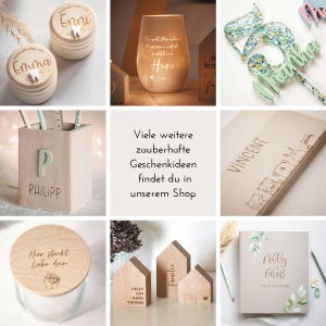 May include: A collection of personalized wooden gifts, including a wooden box with the name "Emma" engraved on it, a wooden box with the name "Enni" engraved on it, a wooden pencil holder with the name "Philipp" engraved on it, a wooden house with the names "Nelly, Leo, Katia, Thomas" engraved on it, a wooden house with the word "Familie" engraved on it, a wooden house with the word "Vincent" engraved on it, a wooden jar with the words "Hier steckt Liebe drin" engraved on it, and a wooden photo album with the name "Nelly Gla&szlig;" engraved on it.