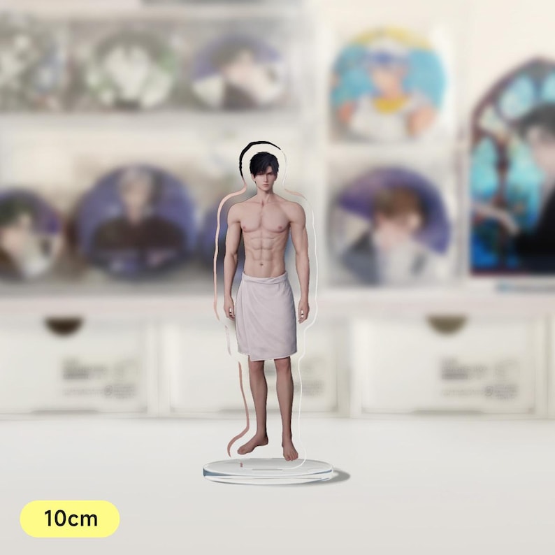 May include: A clear acrylic stand with a 10cm tall figure of a person with short black hair, wearing a white towel. The figure has a muscular build and is standing with their feet slightly apart.