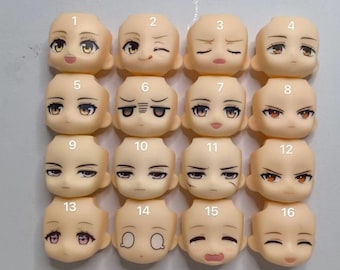 May include: A set of 16 doll face plates with different expressions, numbered 1 through 16. The face plates are made of a light beige plastic and have painted features.
