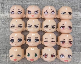 May include: A set of 16 doll face plates with different expressions, including happy, sad, angry, and surprised. The face plates are made of a smooth, white plastic and are numbered 1 through 16.