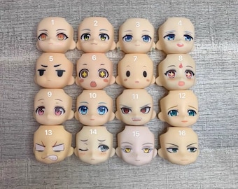 May include: Sixteen different doll head sculpts with various expressions, including happy, sad, angry, and surprised. Each sculpt is numbered 1 through 16.