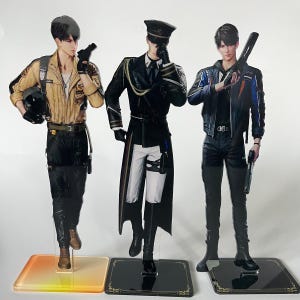 May include: Three anime-style character cutouts. The figures are dressed in various outfits, including a pilot's uniform, a military-style coat, and a modern jacket. Each figure is holding an accessory, such as a helmet, a gun, or a weapon. The cutouts stand on clear or black bases.