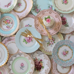 Vintage mismatched dishes in a variety of sizes. Mostly floral patterns in pastel colors with gold or silver trim. Fancy china dishes used for parties and entertaining but often used for plate walls and cottage chic home decor. Mix and Match Plates