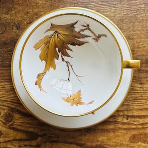 Vintage Heinrich Teacup and Saucer: Hand-Painted Gold Leaf Design, Signed