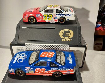 Dale Jarrett 1:24 Scale #32 and #88 Ford Thunderbirds Two-car set with a free unadvertised gift included—Elite Series produced by Action.