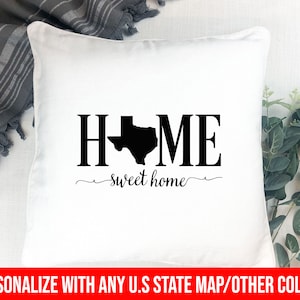 May include: White pillow with black text that reads "HOME" with the state of Texas in the middle of the word. The text "sweet home" is written below the word "HOME".