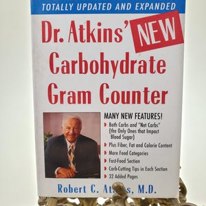 2002 Dr. Atkins Carbohydrate Gram Counter Softcover Book by Robert C Atkins MD published by Evans Press
