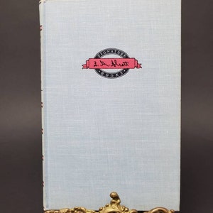 1955 The Story of Lousia May Alcott by Joan Howard illustrated by Flora Smith Hardcover Book published Grosset and Dunlap