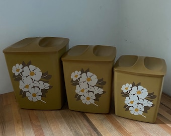 Set of Three Vintage Nesting Canisters with Daisies in Green Color