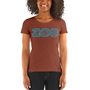 May include: A rust-colored women's t-shirt with a blue outline of the number 208.