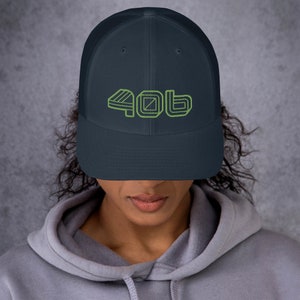 May include: A navy blue trucker hat with a green embroidered design that says "40b".