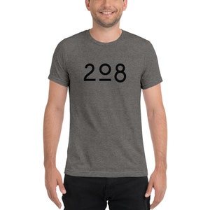 May include: A heather grey t-shirt with a black graphic of the number 208.