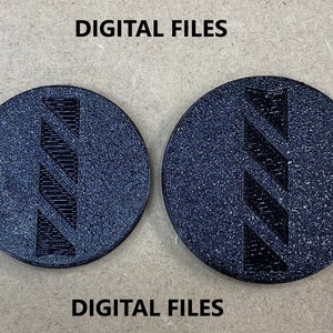 May include: Two black round coasters with a raised, diagonal, striped design. The text "DIGITAL FILES" is printed on the background.