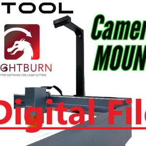 May include: A black metal camera mount for a laser cutter, with the text "Camera Mount" in green letters. The mount is attached to a gray laser cutter with the text "XTOOL" and "LIGHTBURN" visible. The text "Digital File" is in red letters.