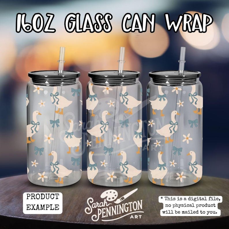 May include: Three clear glass can wraps, each with a black lid and straw. The wraps feature a pattern of white geese with blue bows and small white flowers. The text "16oz Glass Can Wrap" is at the top.