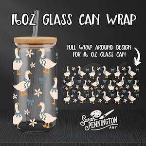 May include: A clear 16 oz glass can wrap with a bamboo lid and straw. The wrap features a pattern of white geese with blue bows and white flowers. The text "16OZ GLASS CAN WRAP" is at the top.