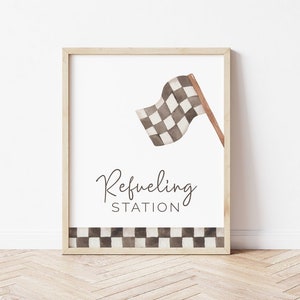May include: A printable sign with a black and white checkered flag and the text "Refueling Station".
