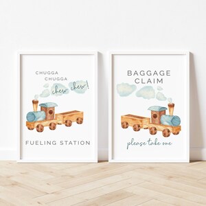 May include: Two printable signs with a cartoon train design. The first sign says "Chugga Chugga Chew Chew!" and "Fueling Station". The second sign says "Baggage Claim" and "Please take one".