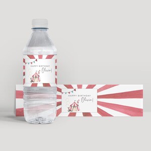 May include: Red and white striped water bottle labels with a circus tent and the text "Happy Birthday Olivia!"