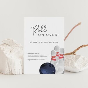 May include: A white invitation card with the text "Roll on Over!" and "Norm is turning five". The card features a watercolor illustration of bowling pins and a bowling ball.