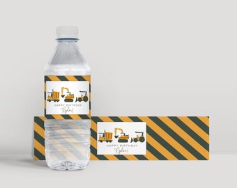 May include: Water bottle labels with a construction theme. The labels feature a yellow dump truck, excavator, and bulldozer with black outlines. The labels have a black and yellow striped background and say "Happy Birthday Ryder!"