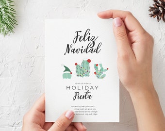 Può includere: Un invito bianco con il testo "Feliz Navidad" e "Join us for a Holiday Fiesta" in nero. La carta presenta un cactus festivo con luci e un cappello di Natale.
