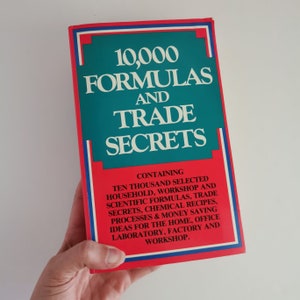 May include: A red, white, and blue book titled "10,000 Formulas and Trade Secrets". The book contains ten thousand selected household, workshop, and scientific formulas, trade secrets, chemical recipes, processes, and money-saving ideas for the home, office, laboratory, factory, and workshop.