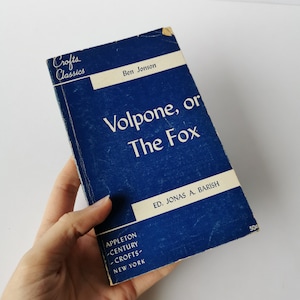 May include: A blue paperback book titled "Volpone, or The Fox" by Ben Jonson. The book is part of the Crofts Classics series and edited by Jonas A. Barish.