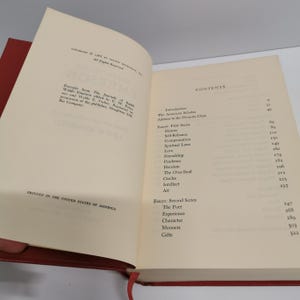 May include: A book titled "The Journals of Ralph Waldo Emerson" edited by W. H. Forbes. The book cover is white with black text. The contents page lists essays such as "History", "Self Reliance", "Compensation", "Spiritual Laws", "Love", "Friendship", "Prudence", "Heroism", "The Over-Soul", "Circles", "Intellect", "Art", "The Poet", "Experience", "Character", "Manners", and "Gifts".