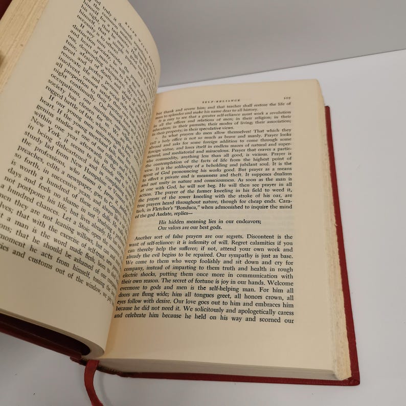 May include: A close-up of a page from a vintage book with text about self-reliance and the importance of not relying on others for help. The text is in a serif font and is printed in black ink on white paper.