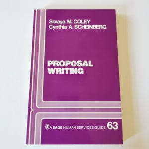 May include: A book with a purple cover, titled "Proposal Writing". The authors' names, Soraya M. Coley and Cynthia A. Scheinberg, are printed at the top. It is part of "A Sage Human Services Guide" series, with the number 63.