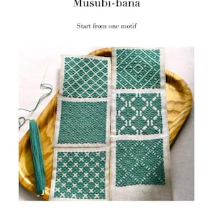May include: A book cover titled Kogin Basics Musubi-bana Start from one motif By Satonobou. The image displays five square fabric swatches featuring intricate teal geometric embroidery patterns on a light beige linen background.