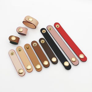 Sujetador de correa de cuero genuino para bolsos, clip de correa ajustable para bolsos, organizador de cables de cuero y soporte para cables